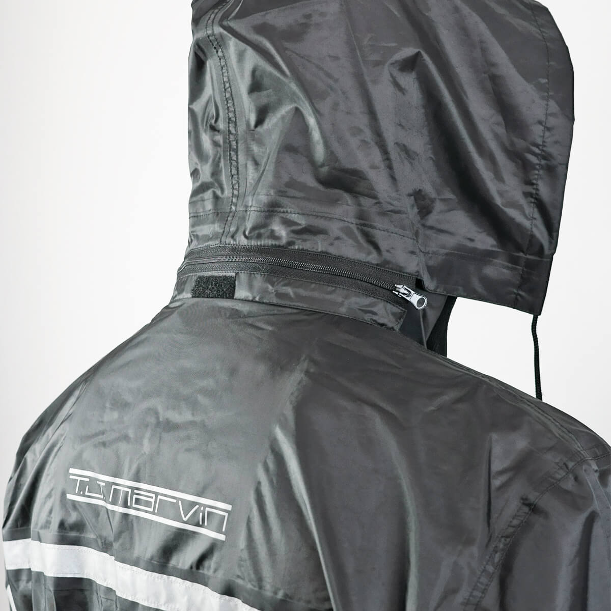 Rainwear set in waterproof synthetic fabric jacket, trousers and boot covers.