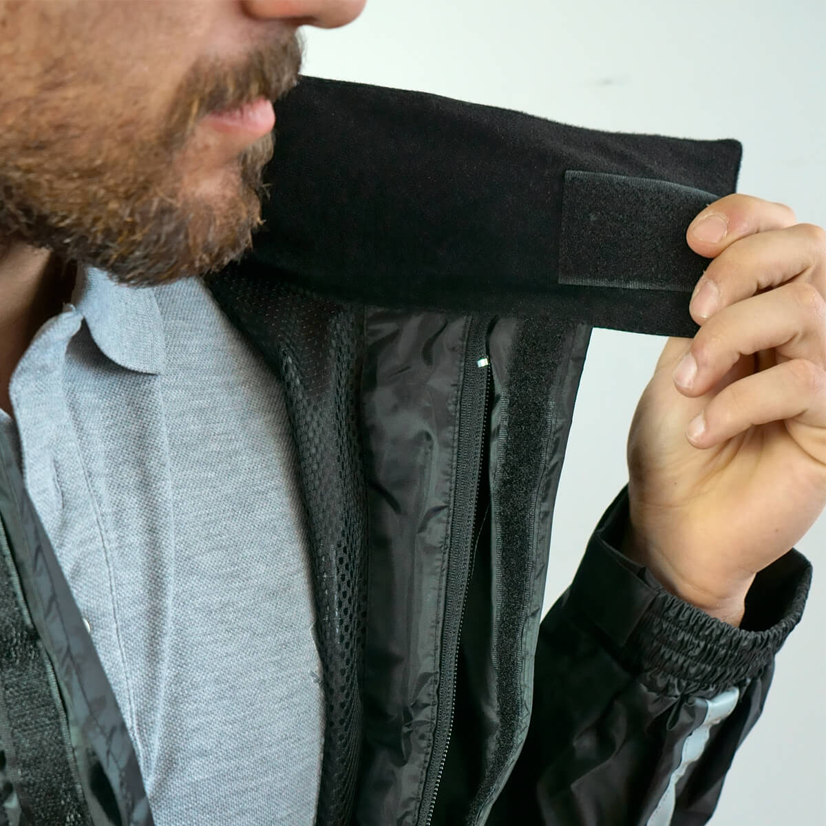 Rainwear set in waterproof synthetic fabric jacket, trousers and boot covers.